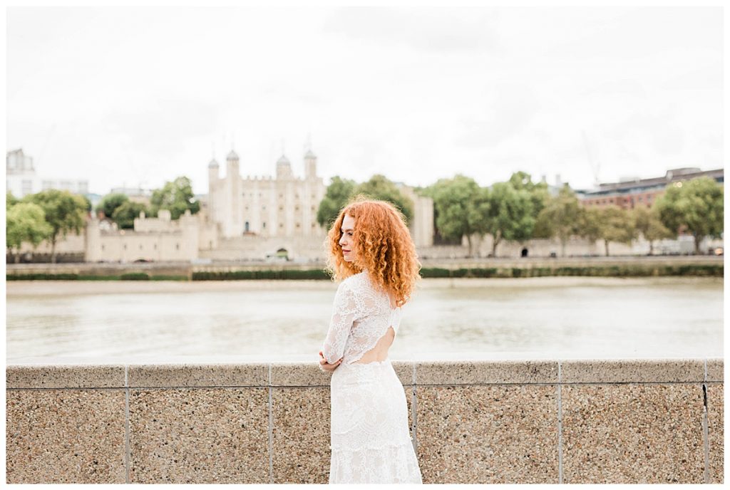 Bride in Claire Pettibone dress in front of the Thames with Tower of London 