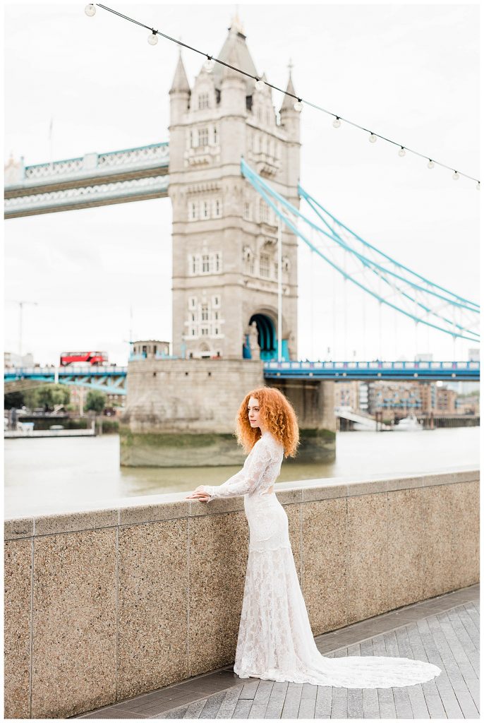 Bride in Claire Pettibone dress in front of Tower Bridge in London
